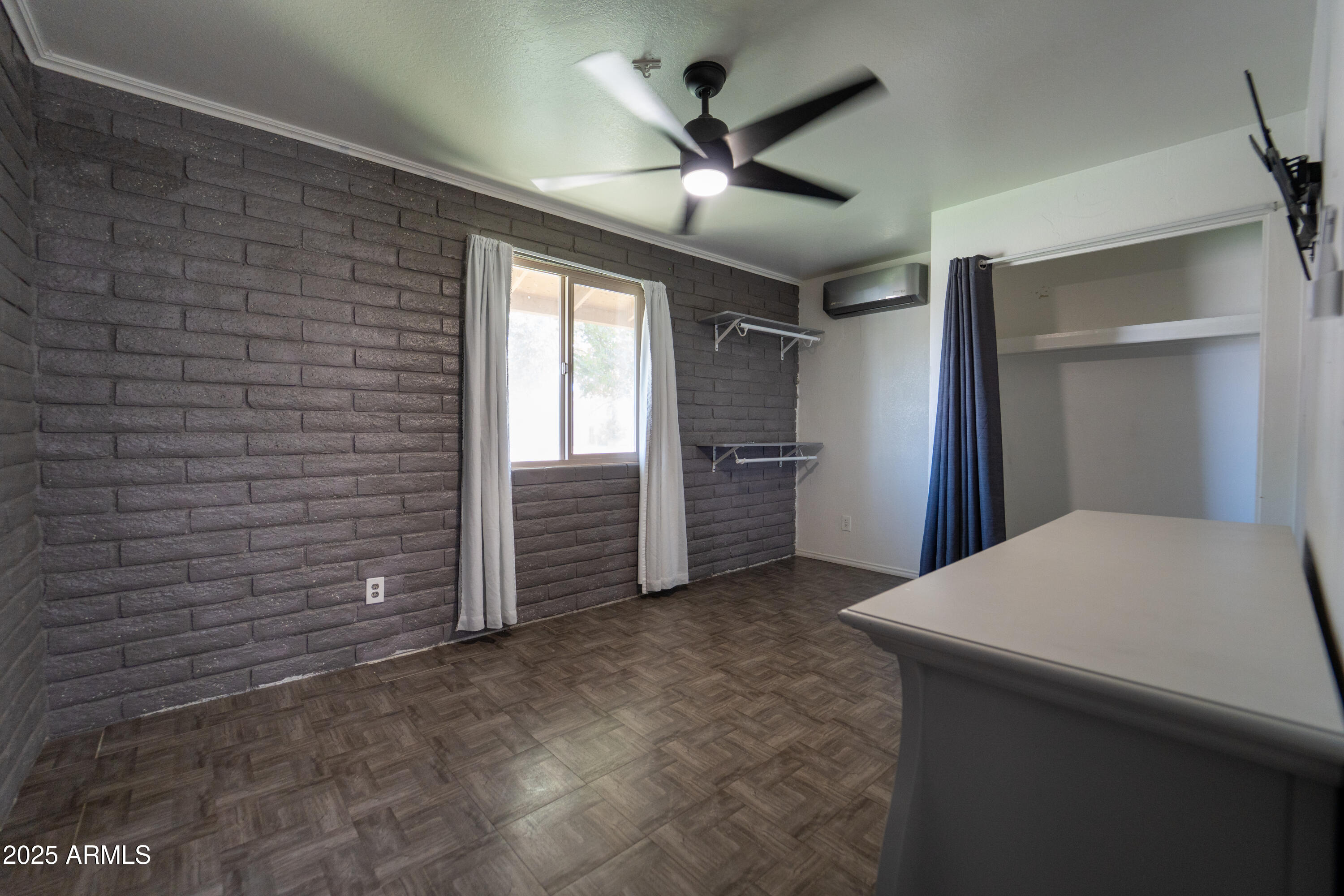 3102 West Paradise Drive Phoenix, AZ 85029 - Photo 17 of 22 a view of empty room with a ceiling fan