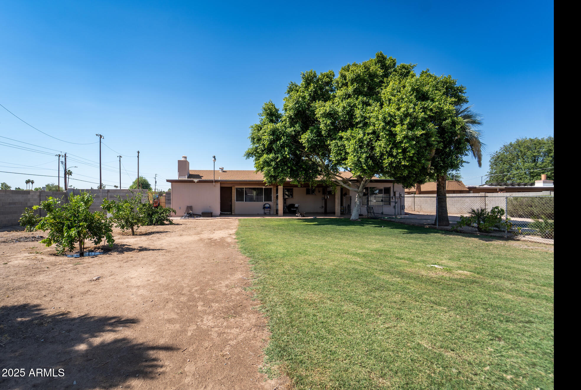 3102 West Paradise Drive Phoenix, AZ 85029 - Photo 19 of 22 a front view of a house with a garden
