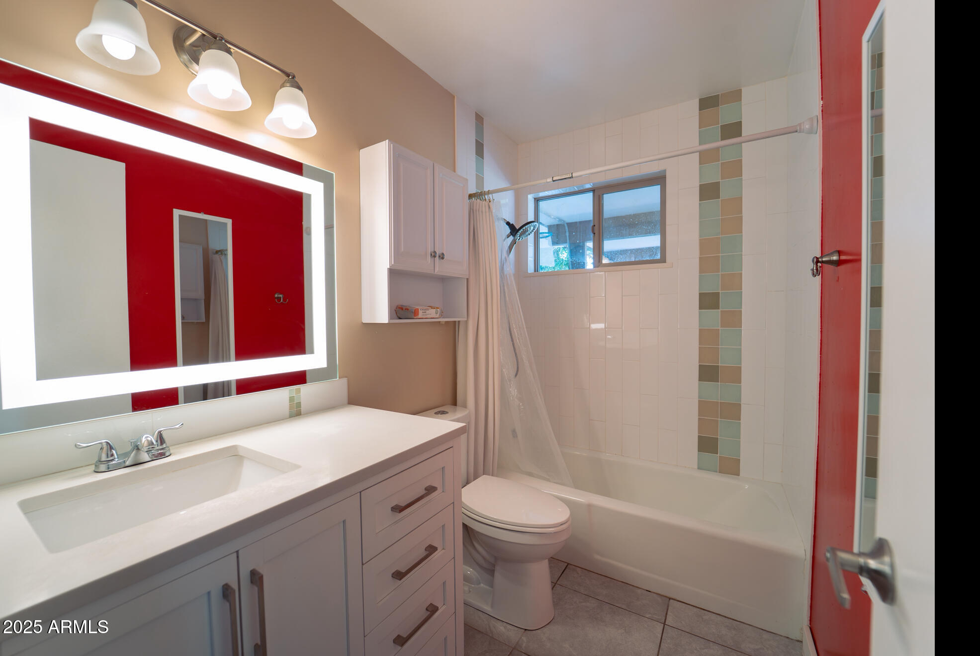 3102 West Paradise Drive Phoenix, AZ 85029 - Photo 10 of 22 a bathroom with a sink a toilet a mirror and shower
