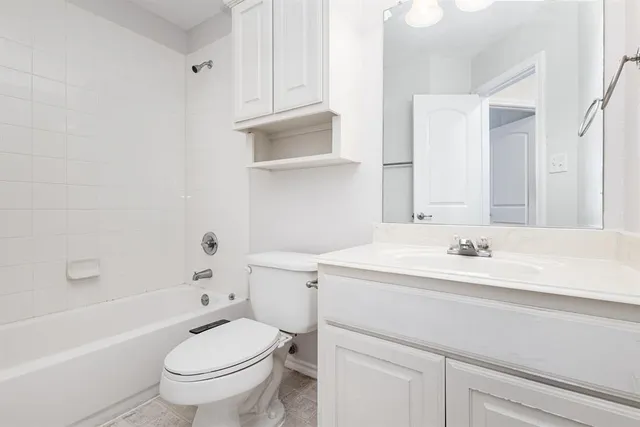 a bathroom with a sink a toilet and a bathtub