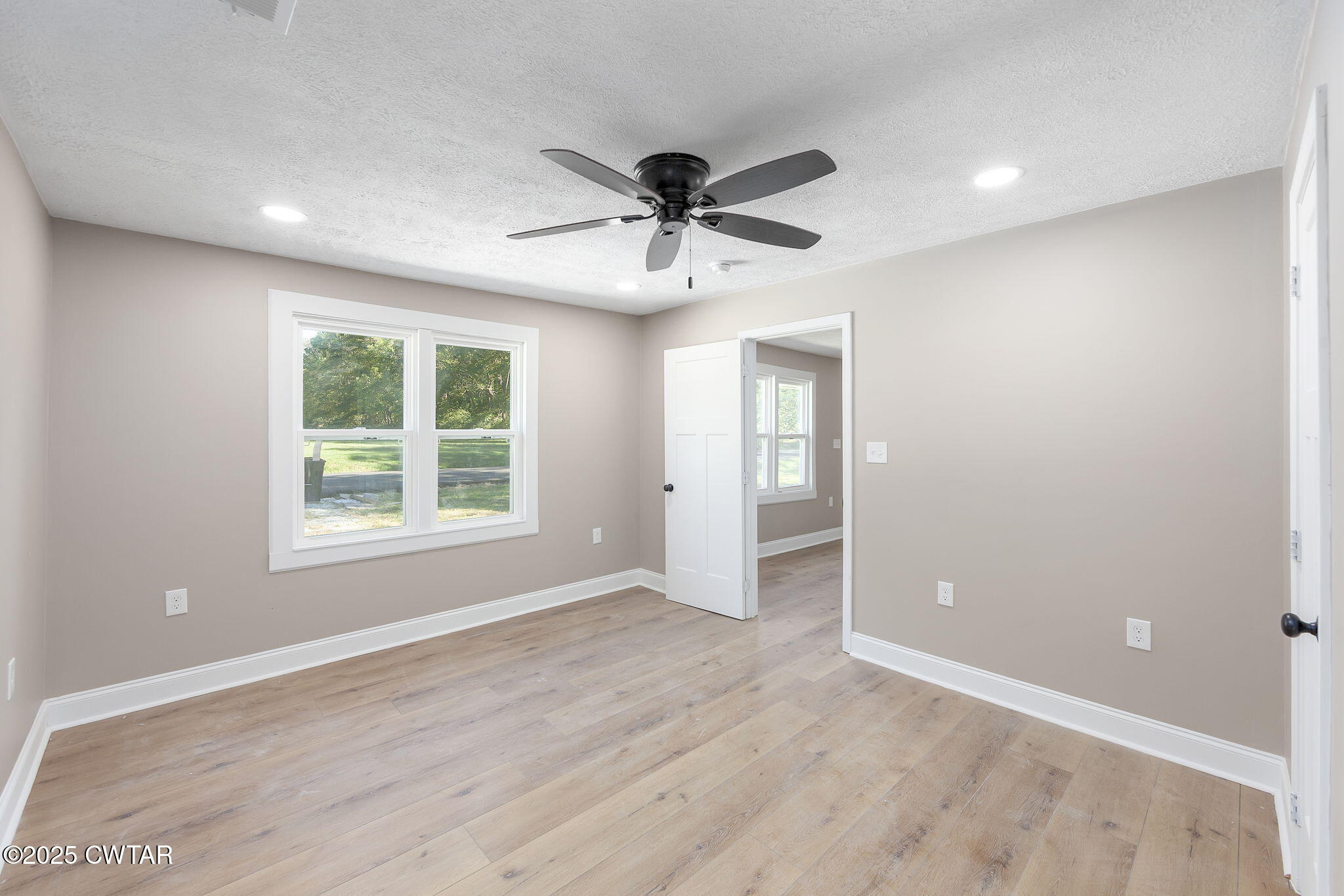 424 Rozelle Street Gibson, TN 38343 - Photo 11 of 20 an empty room with fan and windows
