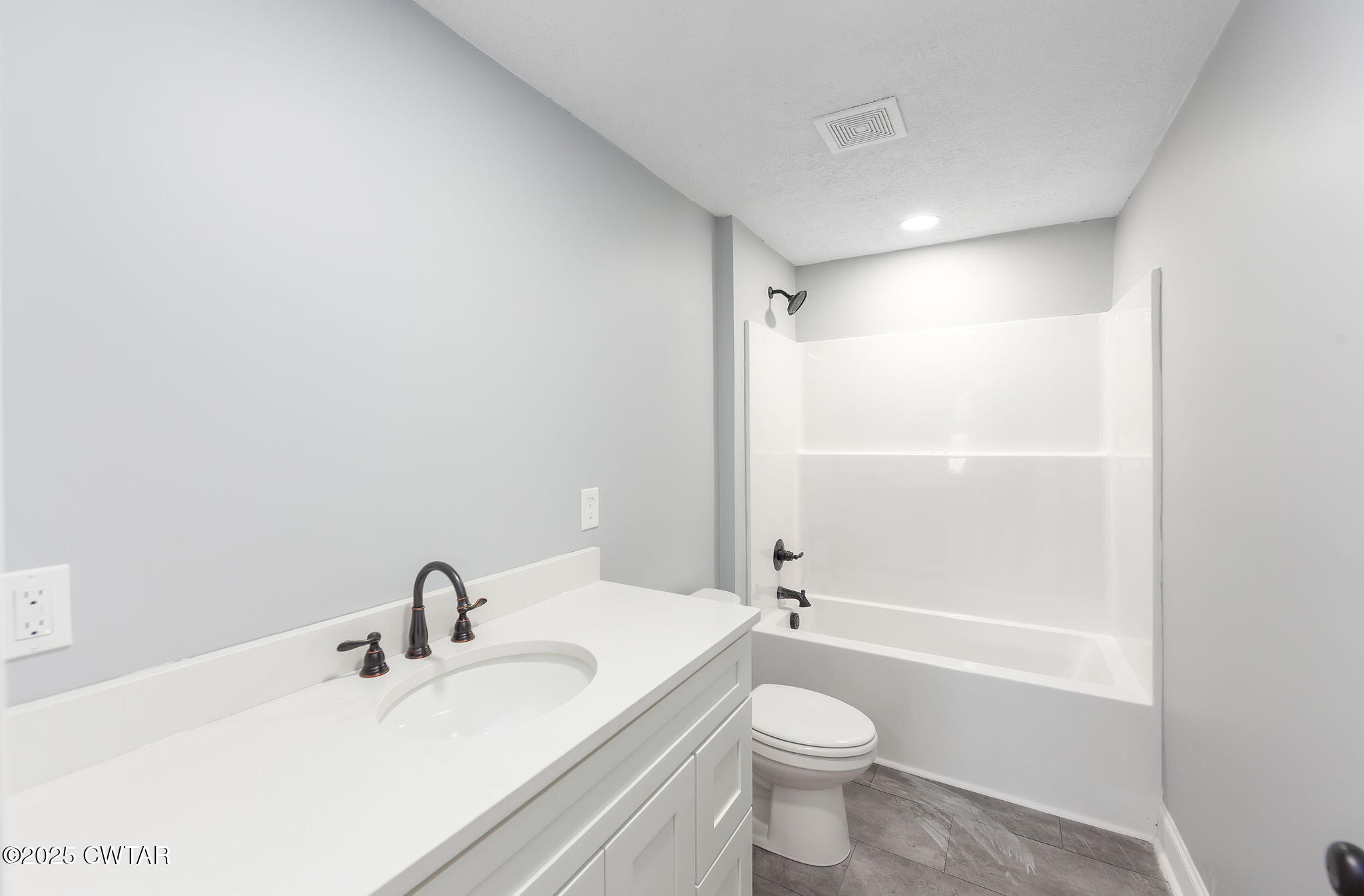 424 Rozelle Street Gibson, TN 38343 - Photo 12 of 20 a bathroom with a granite countertop sink toilet and shower