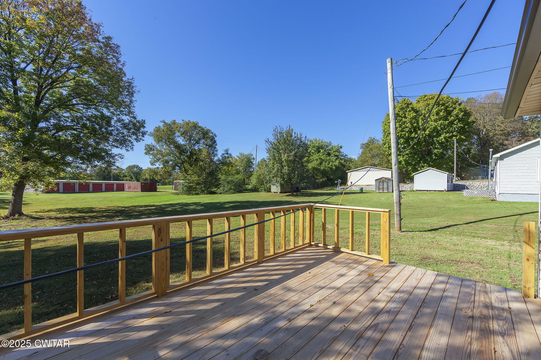 424 Rozelle Street Gibson, TN 38343 - Photo 16 of 20 a view of a deck with a big yard