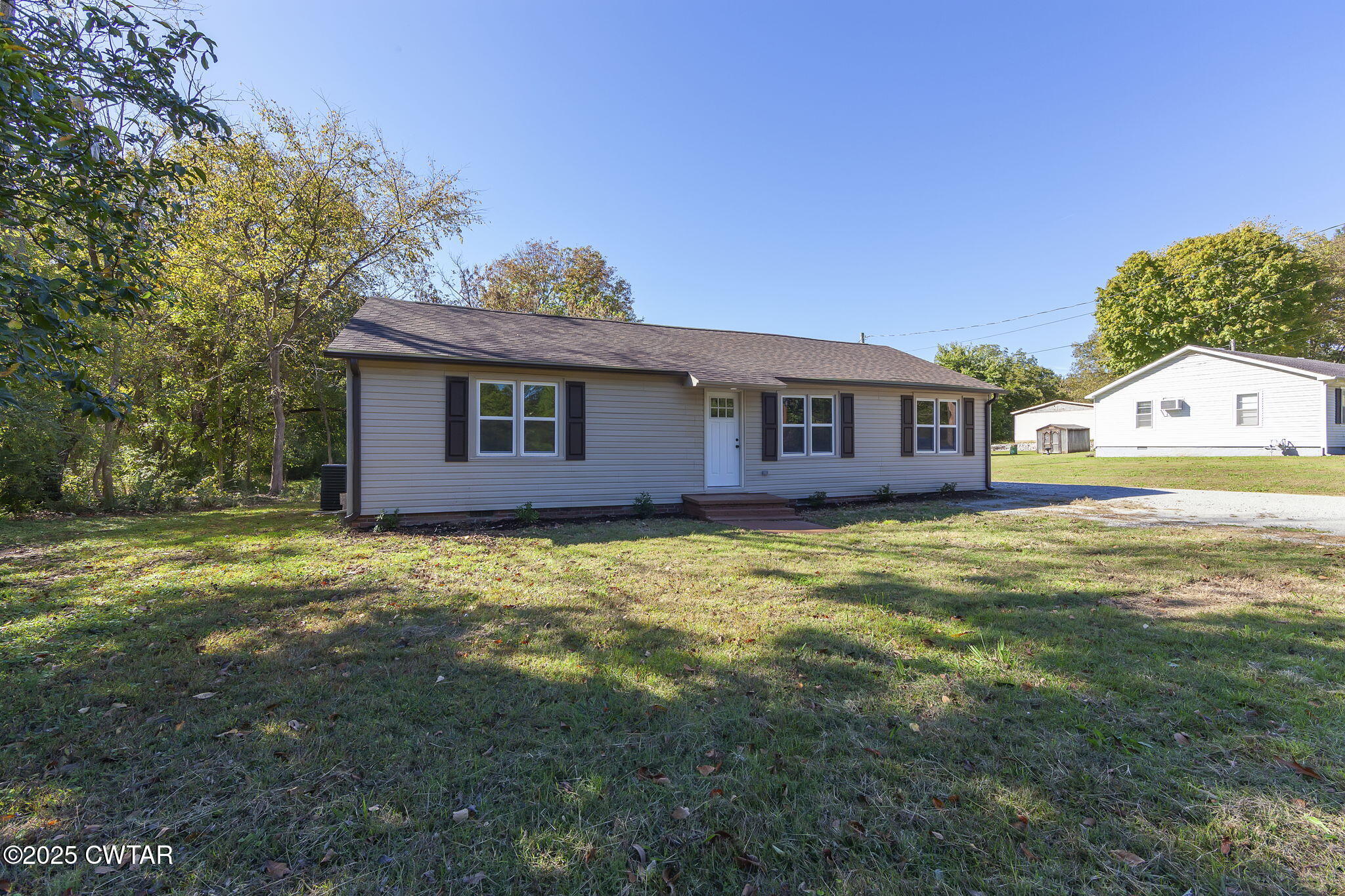 424 Rozelle Street Gibson, TN 38343 - Photo 2 of 20 a view of a house with a backyard
