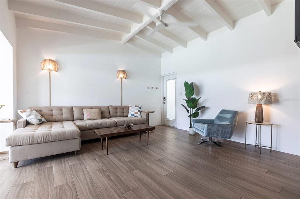 6006 Midnight Pass Road, Unit 53 Sarasota, FL 34242 - Photo 3 of 20 a living room with furniture