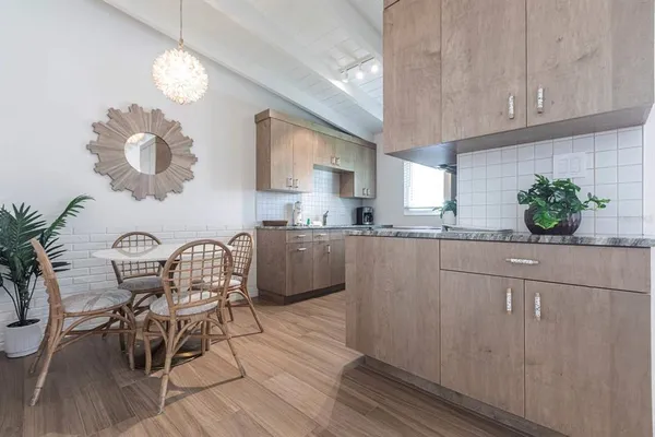 a kitchen with a table and chairs in it