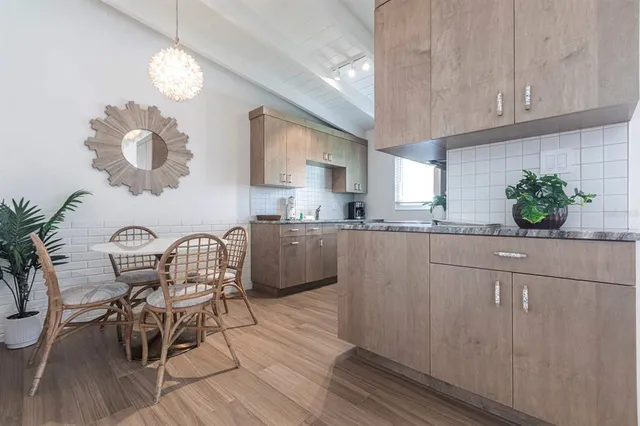 a kitchen with a table and chairs in it