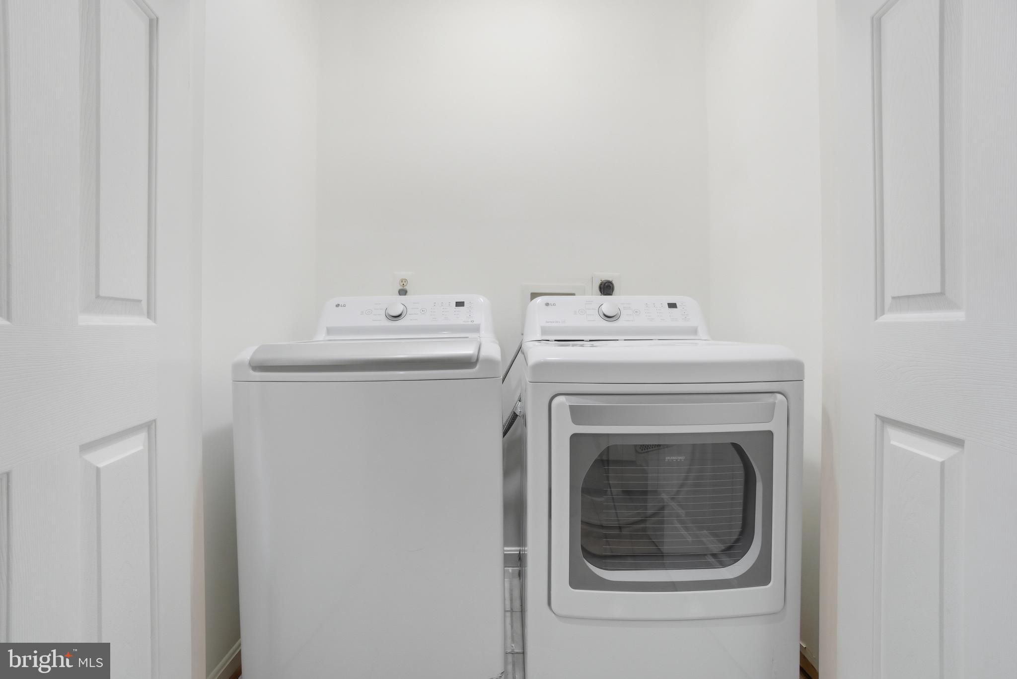 34 Hawk Rise Lane, Unit 103 Owings Mills, MD 21117 - Photo 14 of 29 a utility room with dryer and washer