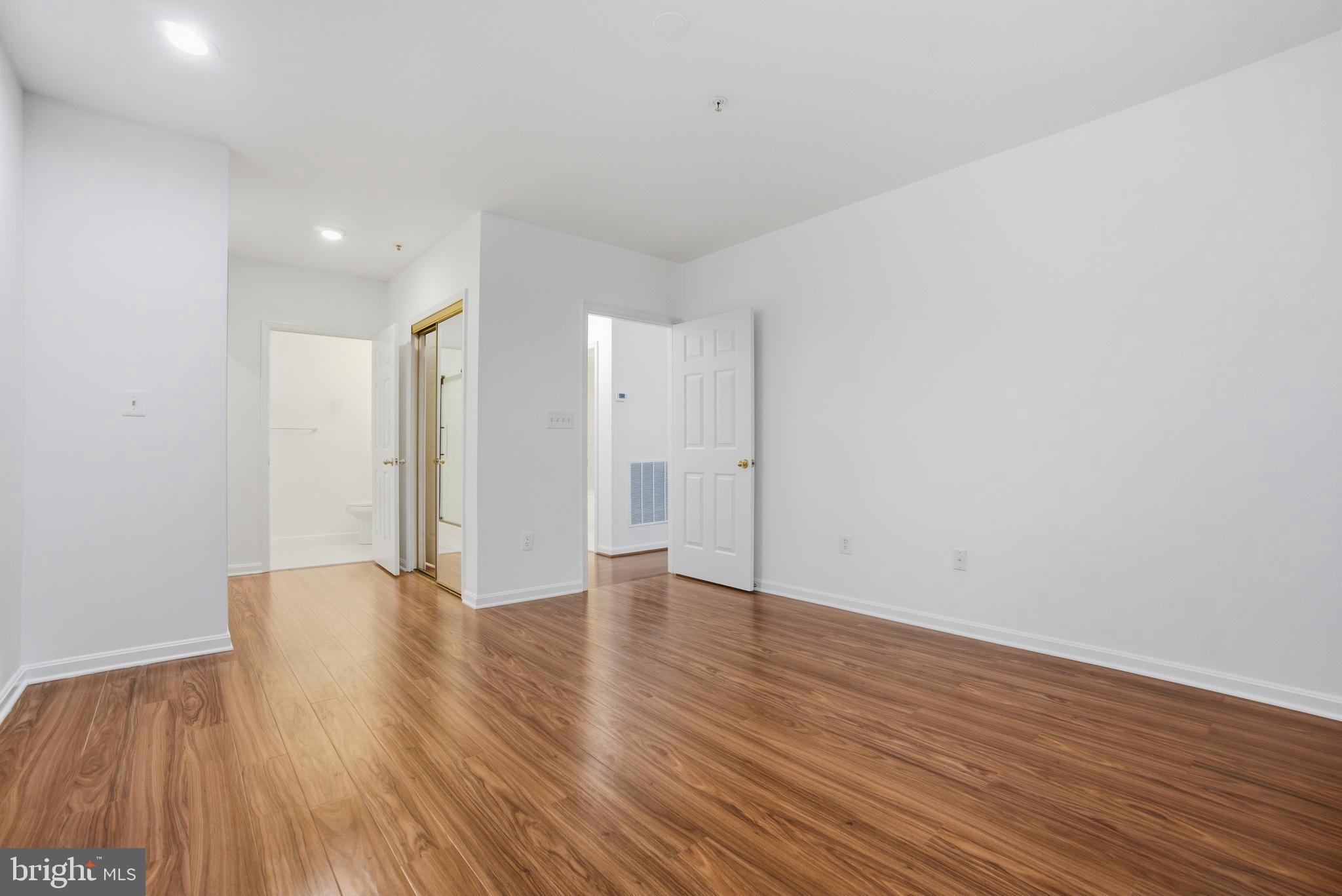 34 Hawk Rise Lane, Unit 103 Owings Mills, MD 21117 - Photo 16 of 29 a view of an empty room with wooden floor