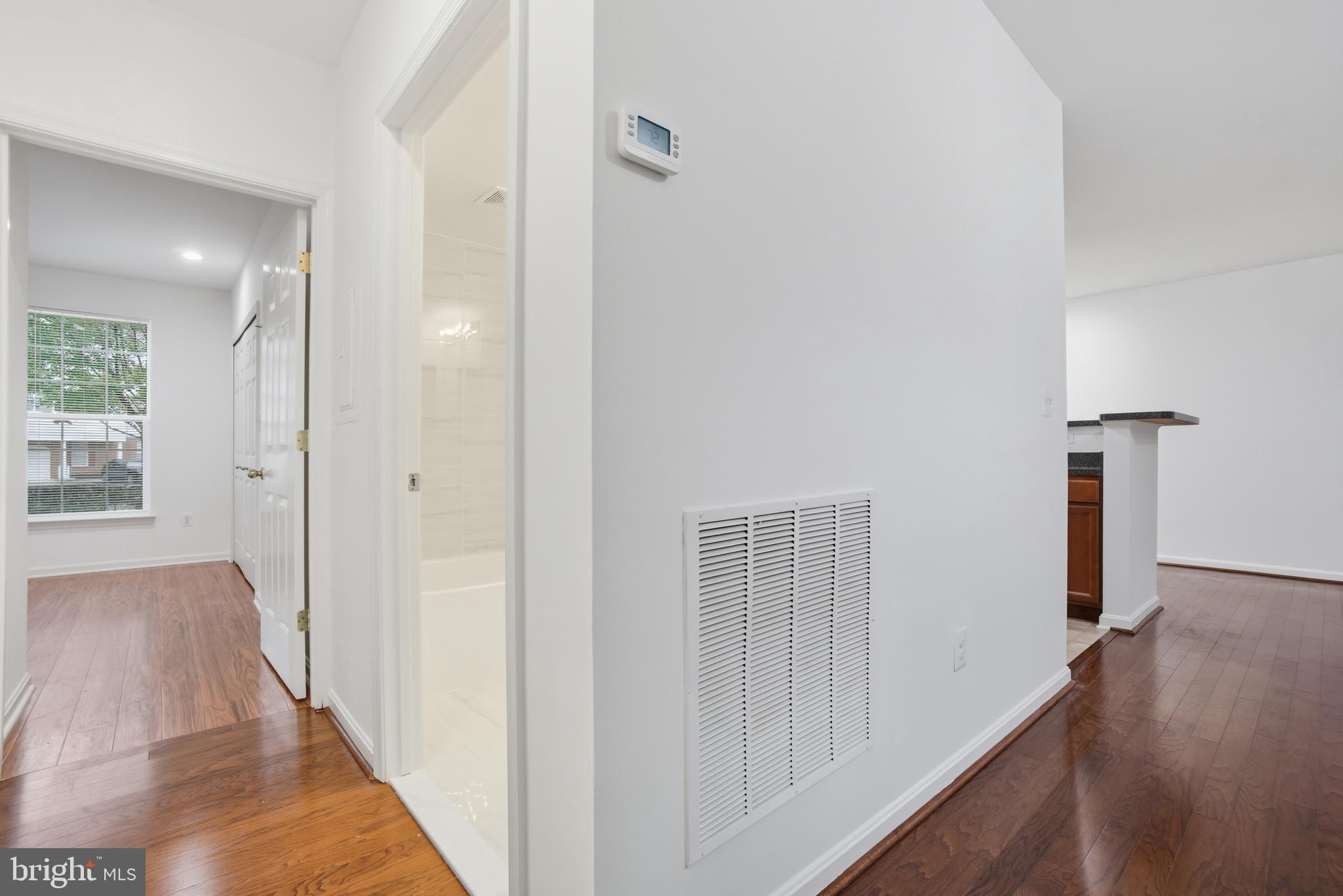 34 Hawk Rise Lane, Unit 103 Owings Mills, MD 21117 - Photo 20 of 29 a view of a hallway with wooden floor