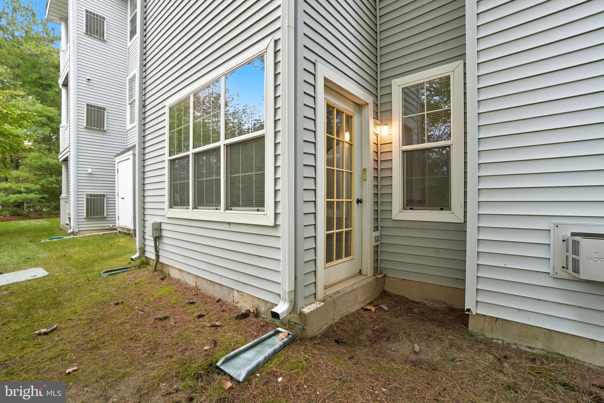 34 Hawk Rise Lane, Unit 103 Owings Mills, MD 21117 - Photo 25 of 29 a view of a house with a yard