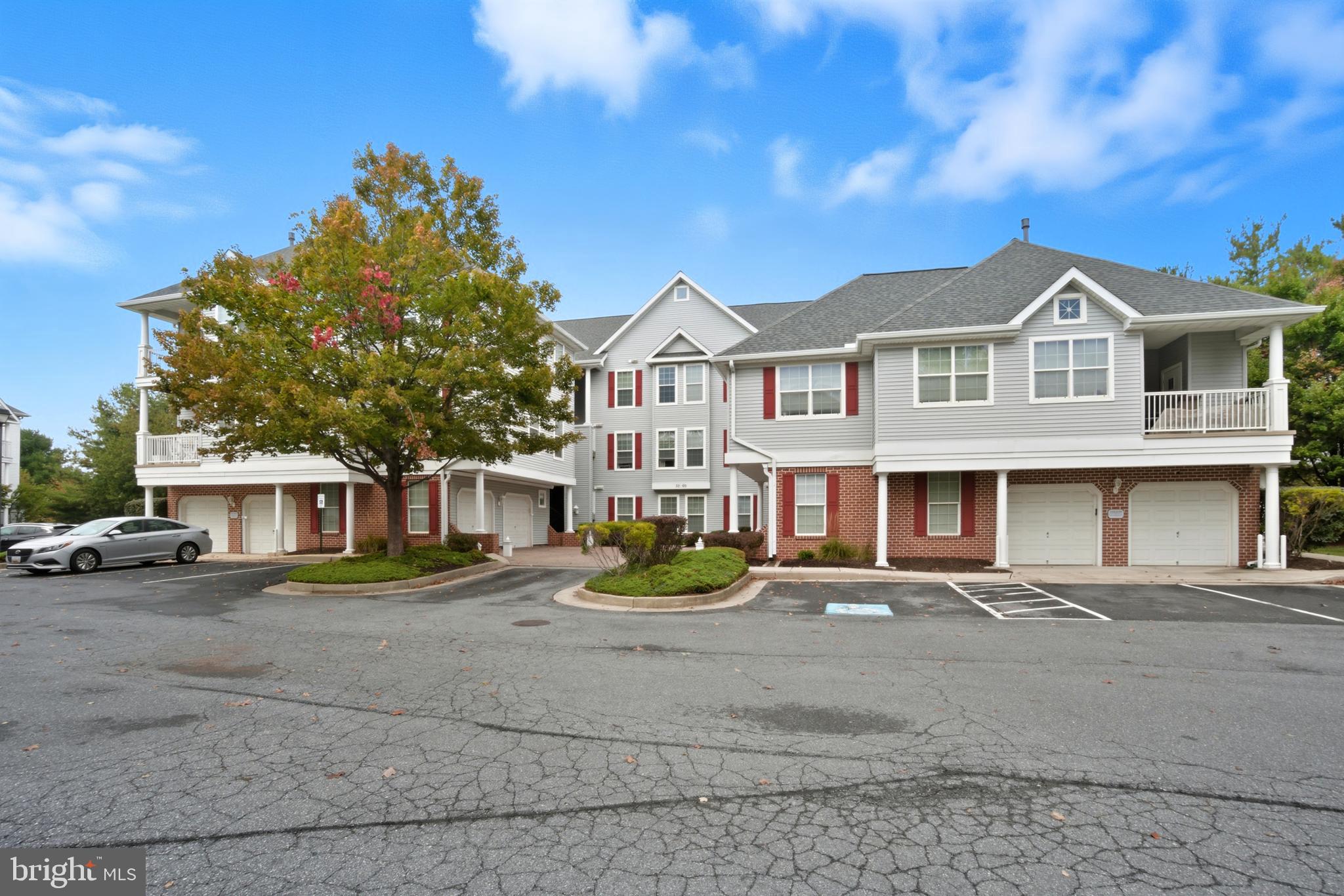 34 Hawk Rise Lane, Unit 103 Owings Mills, MD 21117 - Photo 27 of 29 a front view of a house with garden