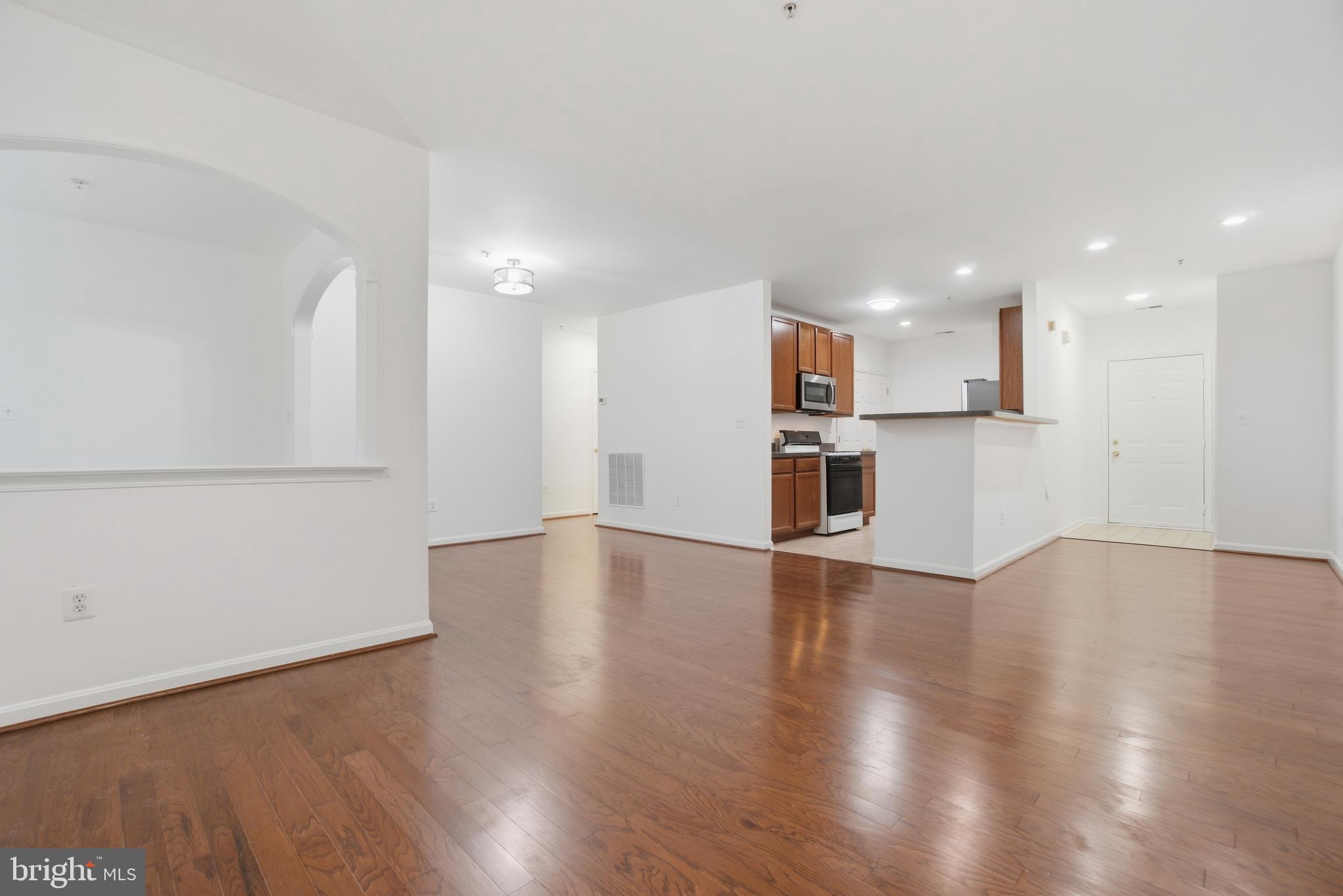 34 Hawk Rise Lane, Unit 103 Owings Mills, MD 21117 - Photo 6 of 29 a view of a kitchen with a sink and a refrigerator
