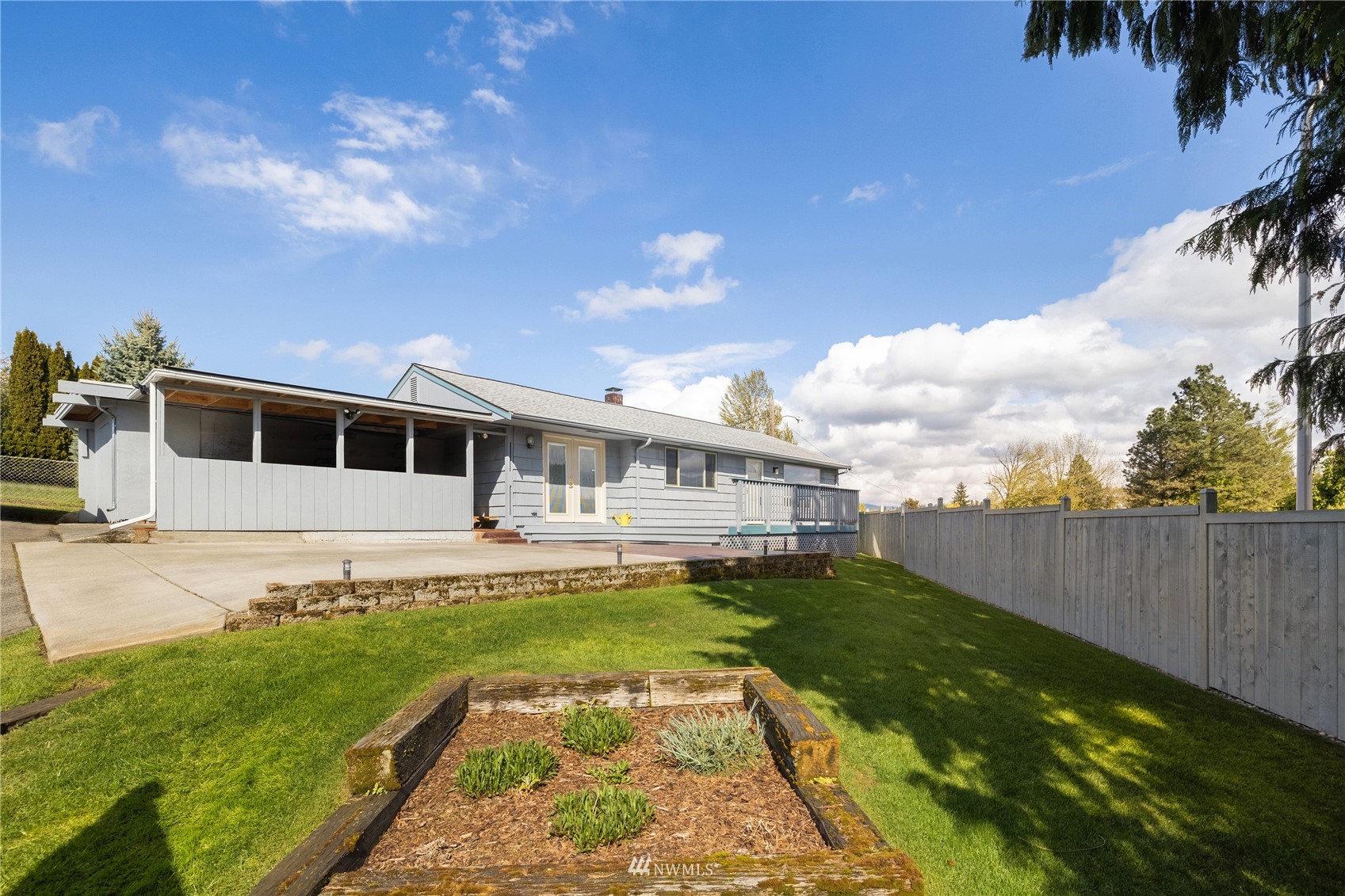 420 Southwest Sunset Boulevard Renton, WA 98057 - Photo 3 of 36 a view of a house with a yard
