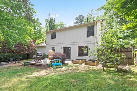 a backyard of a house with seating space