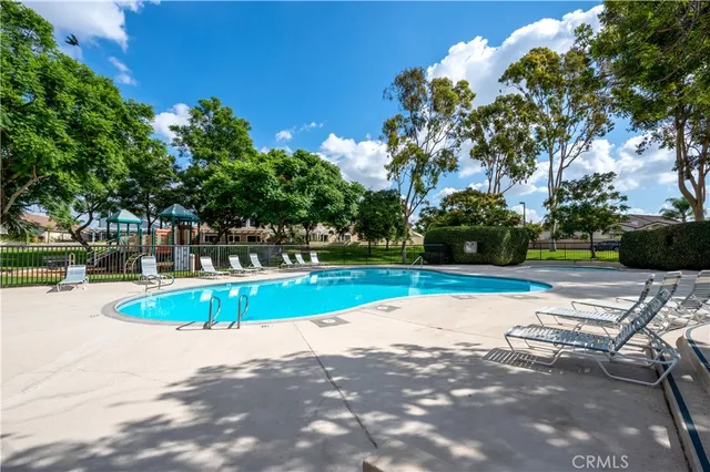 a view of a swimming pool with a patio