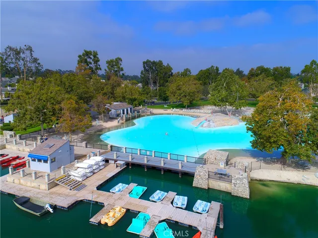 a view of a swimming pool patio and outdoor seating
