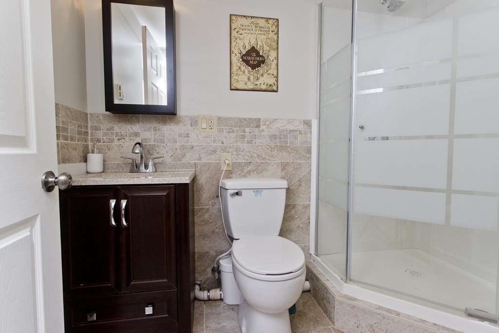 15 Circle Drive Wilbraham, MA 01095 - Photo 19 of 42 a bathroom with a toilet sink and mirror