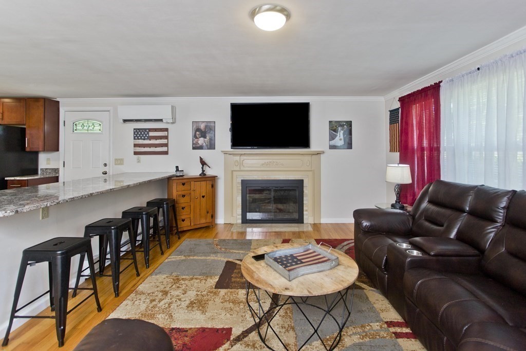 15 Circle Drive Wilbraham, MA 01095 - Photo 25 of 42 a living room with furniture and a flat screen tv