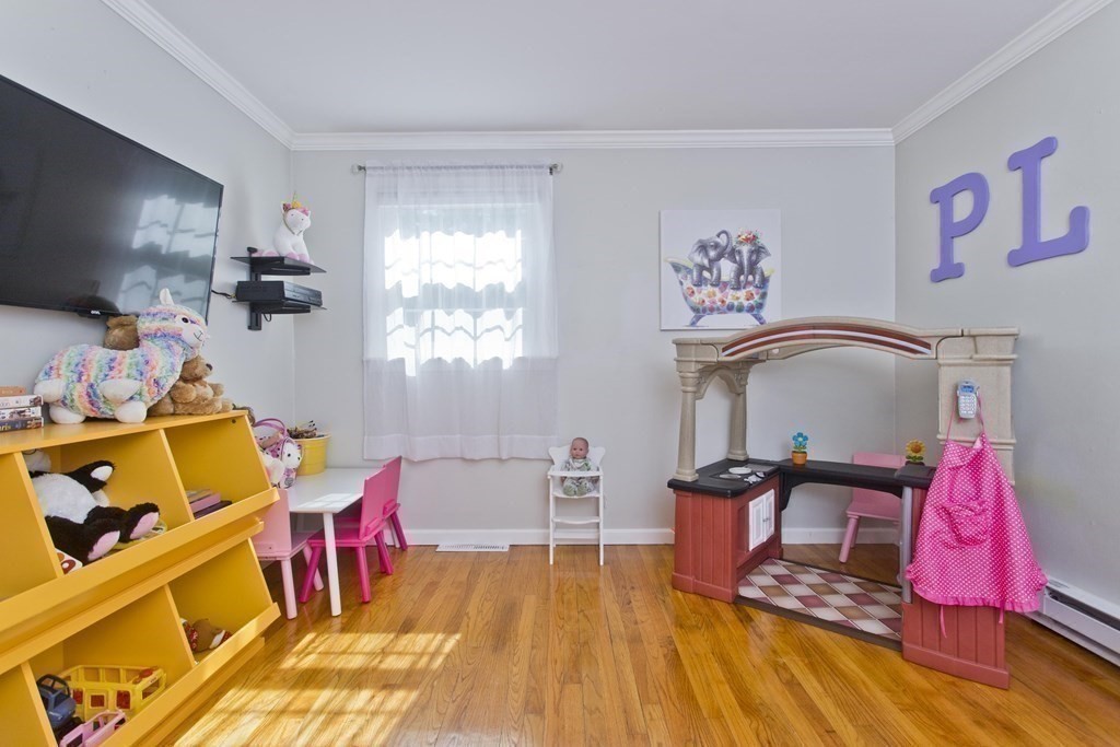 15 Circle Drive Wilbraham, MA 01095 - Photo 31 of 42 a living room with furniture and a flat screen tv