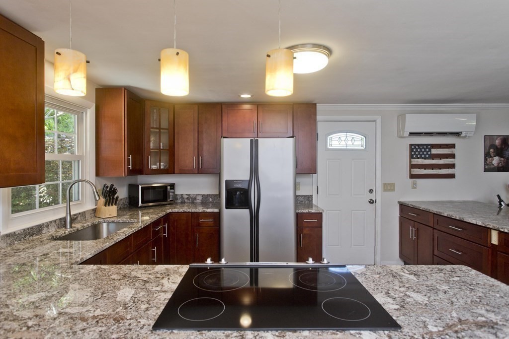 15 Circle Drive Wilbraham, MA 01095 - Photo 4 of 42 a kitchen with a sink a counter top space and cabinets