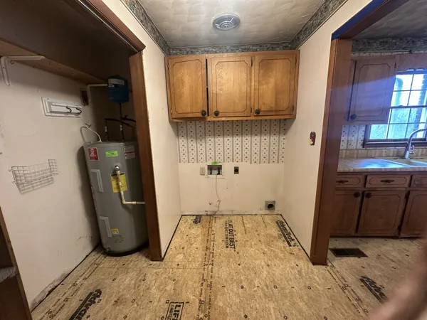 a view of a storage and utility room with a sink
