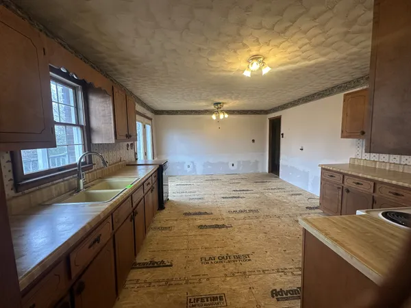 a kitchen with a stove and a sink