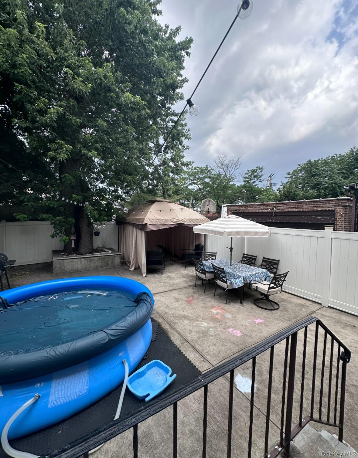 103-17 Plattwood Avenue Queens, NY 11417 - Photo 5 of 25 a view of yard with seating area