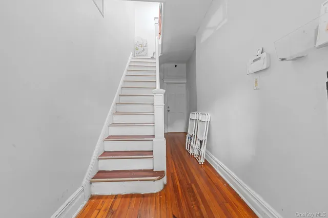 a view of stairs and wooden floor