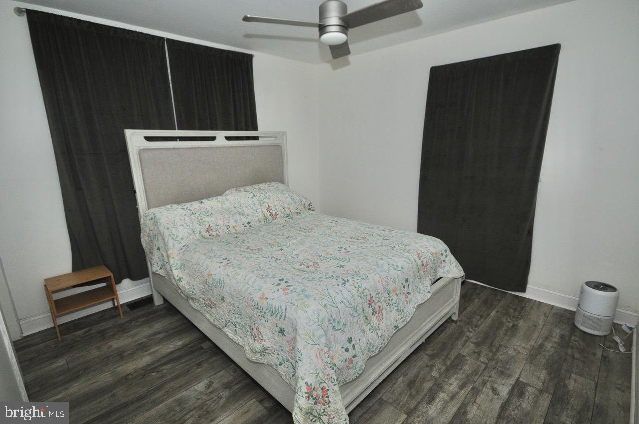 2413 Shelburn Road Millville, NJ 08332 - Photo 31 of 41 a bed sitting in a bedroom next to a cabinet