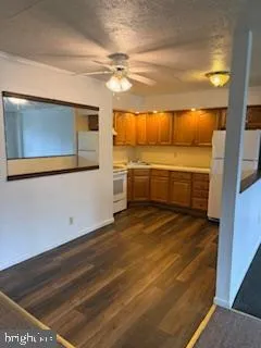 a spacious bathroom with a granite countertop sink and a mirror