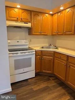 a kitchen with a sink cabinets and appliances