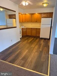 a view of a room with a kitchen