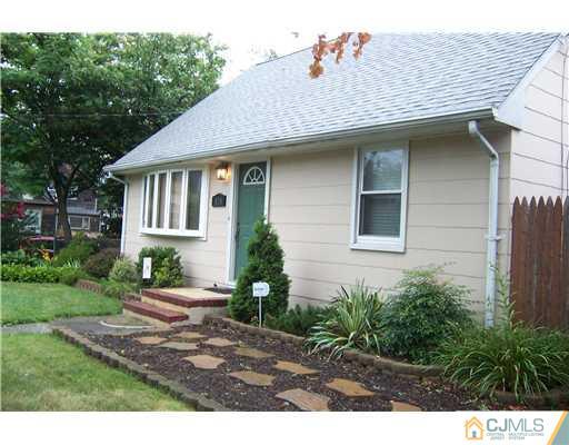 528 Chain O' Hills Road Colonia, NJ 07067 - Photo 1 of 25 a front view of a house with a yard