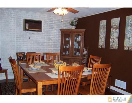 528 Chain O' Hills Road Colonia, NJ 07067 - Photo 8 of 25 a view of a dining room with furniture and window