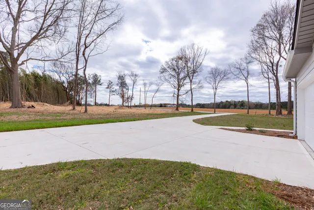 a view of a swimming pool with an outdoor space and seating area