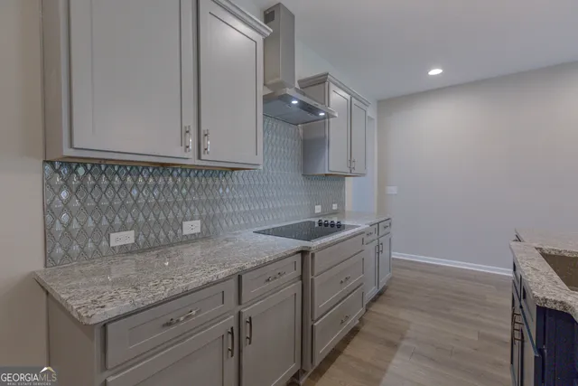 a kitchen with a sink and cabinets