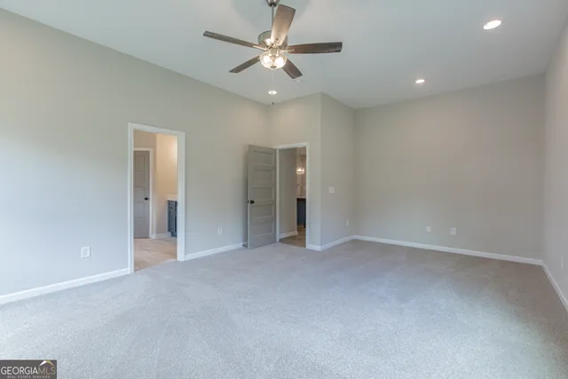 a bathroom with double vanity sinks and a mirror