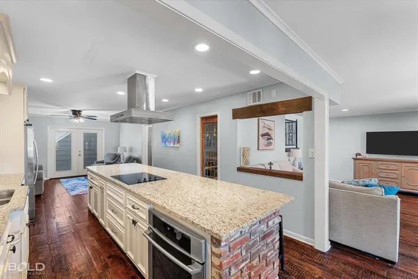 a kitchen with a stove and a refrigerator