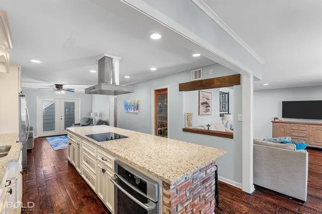 a kitchen with a stove and a refrigerator