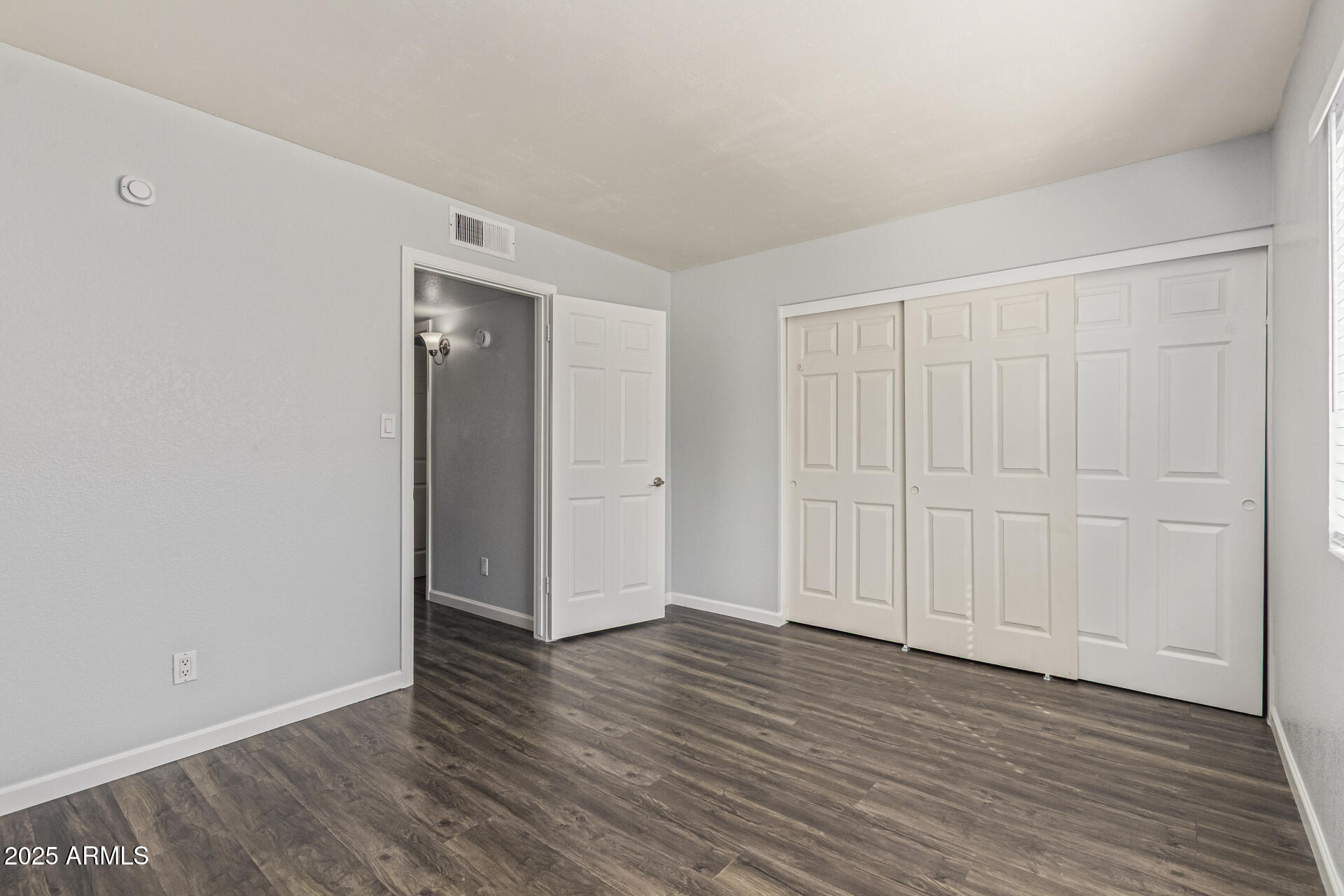 548 South Wilson Street, Unit 104 Tempe, AZ 85281 - Photo 12 of 18 a view of an empty room with wooden floor