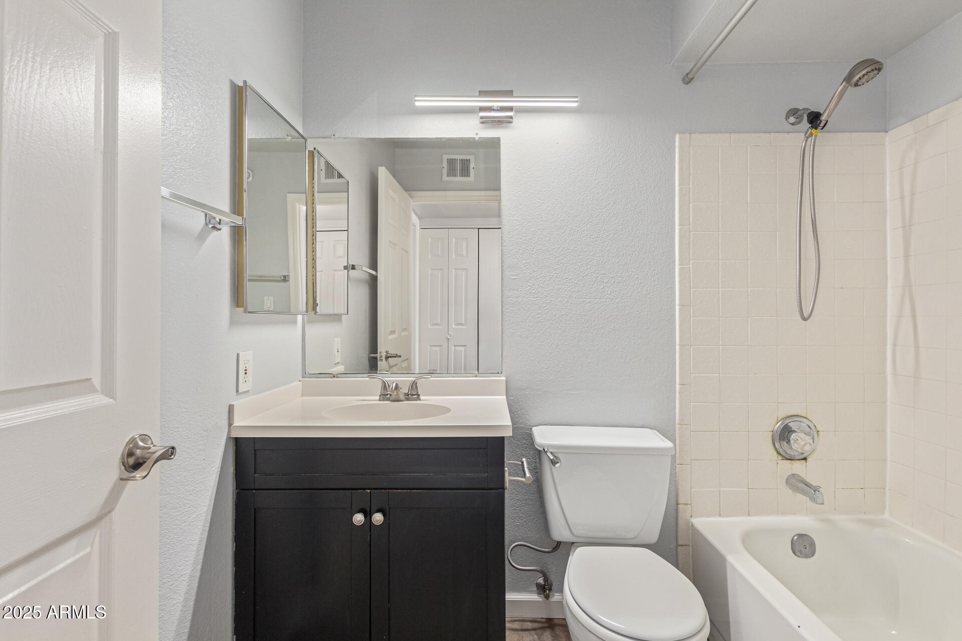 548 South Wilson Street, Unit 104 Tempe, AZ 85281 - Photo 13 of 18 a bathroom with a sink toilet and shower