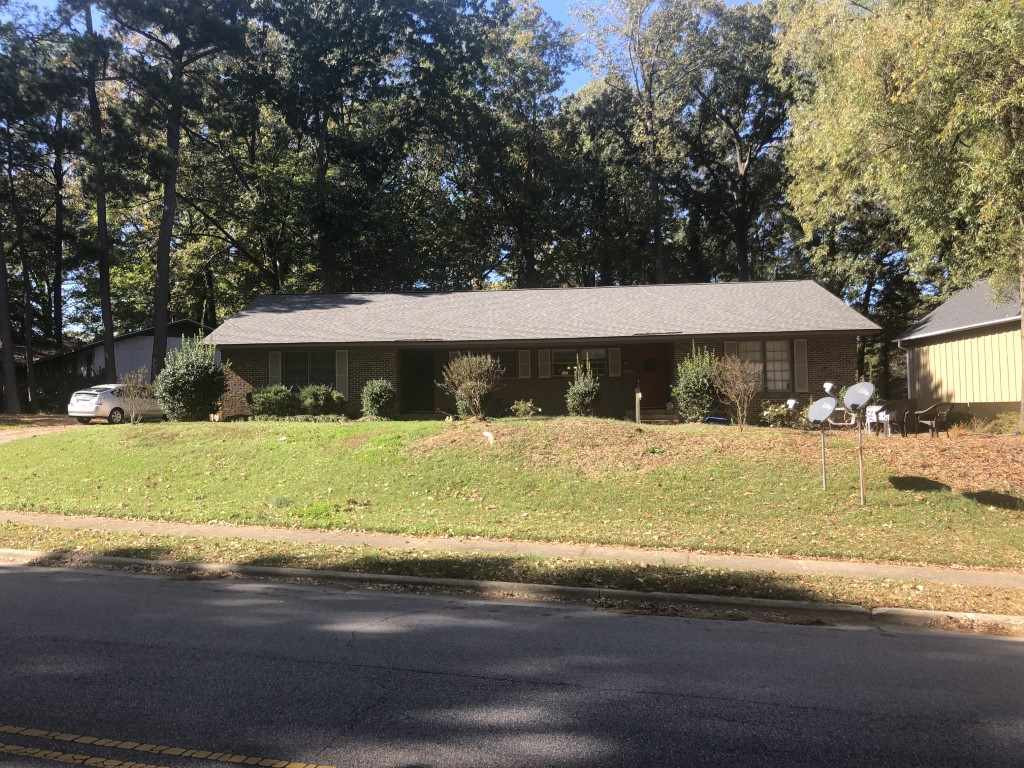 1709 Quail Ridge Road Raleigh, NC 27609 - Photo 1 of 14 a front view of a house with a yard