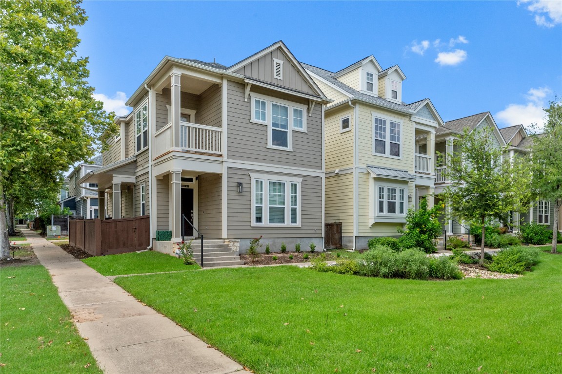 3900 Threadgill Street, Unit 16 Austin, TX 78723 - Photo 11 of 40 a front view of a house with a yard and porch