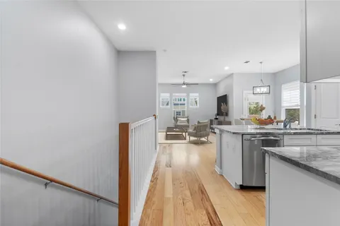 a kitchen with stainless steel appliances granite countertop a lot of counter top and sink