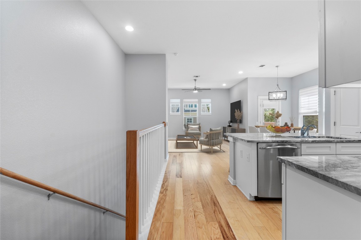 3900 Threadgill Street, Unit 16 Austin, TX 78723 - Photo 12 of 40 a kitchen with stainless steel appliances granite countertop a lot of counter top and sink