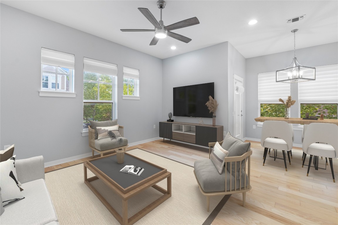 3900 Threadgill Street, Unit 16 Austin, TX 78723 - Photo 13 of 40 a living room with furniture a flat screen tv and a large window