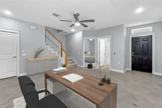 a dining room with table and chairs