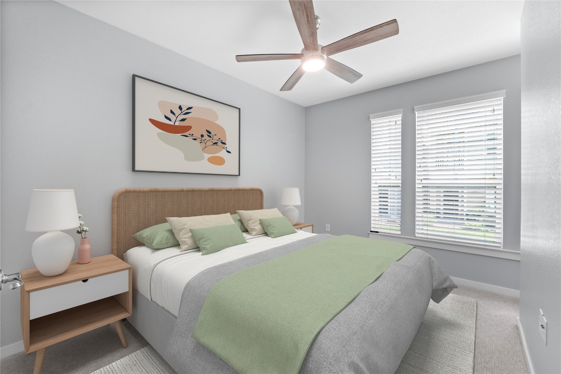 3900 Threadgill Street, Unit 16 Austin, TX 78723 - Photo 22 of 40 a bedroom with a bed and a large window