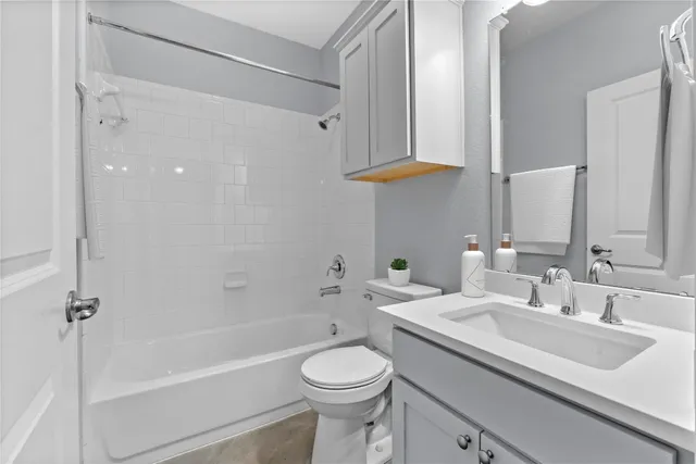 a bathroom with a sink a toilet and a bathtub